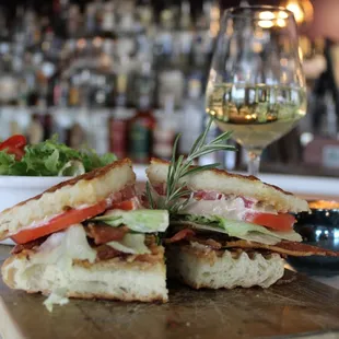 ows a club sandwich on a cutting board