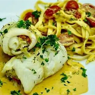a plate of pasta and fish