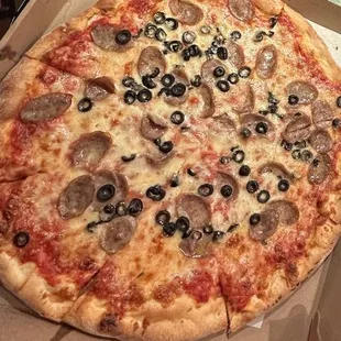 Italian sausage and black olive pizza