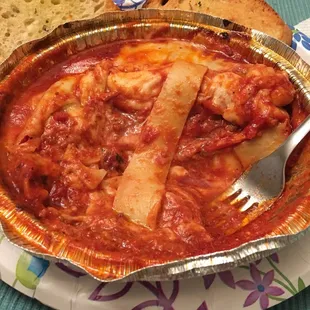 a bowl of pasta and bread