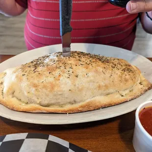 Belly Buster Stromboli - it&apos;s literally platter-sized!