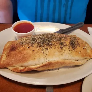 Bellybuster Stromboli the size of a platter!