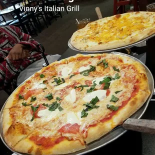 Margarita pizza and buffalo chicken pizza.