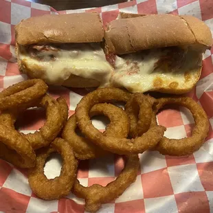 Meatball parmigiana sub with onion rings