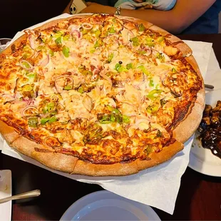Build your own pizza with chicken, bell peppers, onions, mushrooms and fresh garlic.