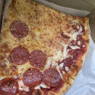 One pepperoni, one pizza slice