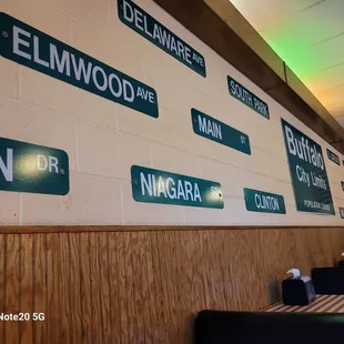 a wall of street signs