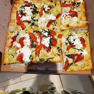 Sicilian with artichokes, roasted peppers, ricotta, basil and hot peppers. Delish!!!!