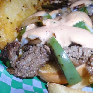Philly cheesesteak sandwich, close-up.
