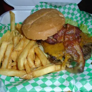 Bacon cheeseburger with fries to-go.