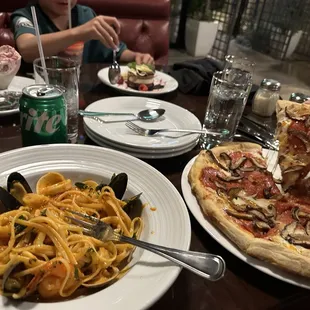 Seafood pasta and vegetarian pizza.