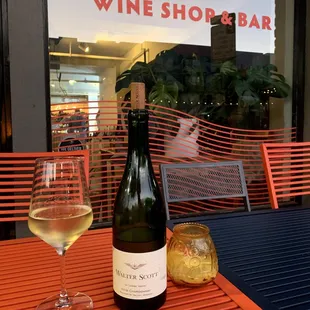 a bottle of wine and a glass of wine