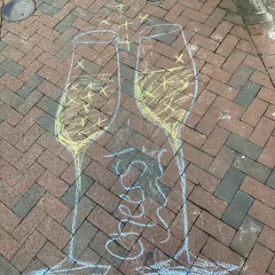 a chalk drawing of two glasses of wine