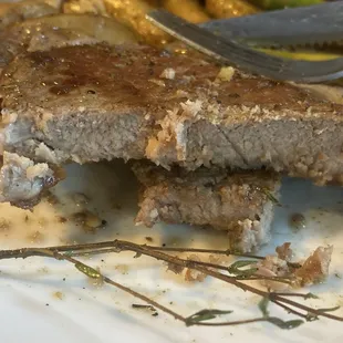 a piece of steak and asparagus