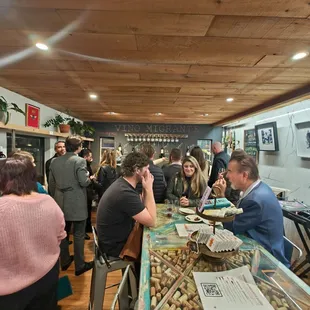 a group of people at a wine tasting