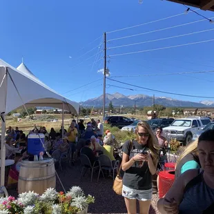 a woman standing in front of a group of people