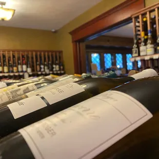 rows of wine bottles in a wine cellar