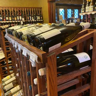 a wine rack full of wine bottles
