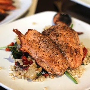 Coriander Seared Organic Salmon ($31) - Israeli cops cops, artichoke, sundried tomato, spinach