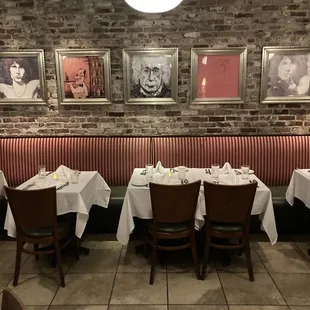 a dining room with a brick wall