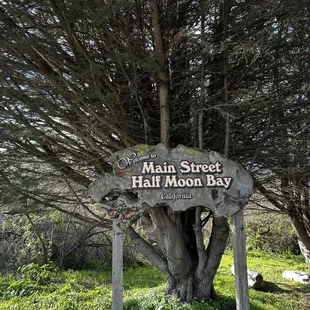 a sign for main street half moon bay