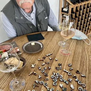 Relaxing with soft music, lovely wine, delicious charcuterie, and an amazing wooden puzzle. So nice to feel unrushed.