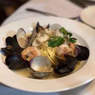 a plate of seafood and pasta