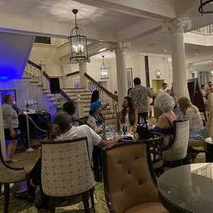 a group of people sitting at a restaurant