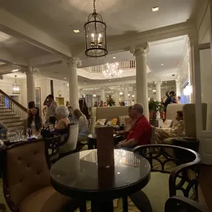 a group of people sitting at a restaurant
