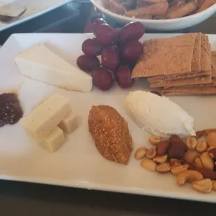 Cheese board. A soft, medium and hard cheese. Goat cheese with lemon curd was yum-O. Fig jam and pineapple mustard seed jam.