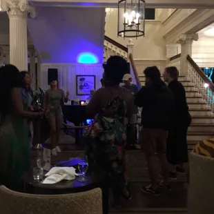 a group of people in a hotel lobby