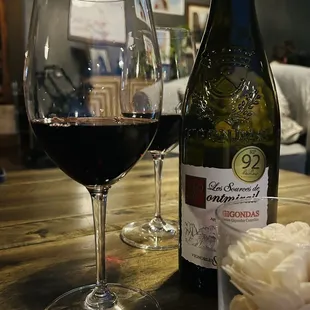 a glass of wine and a bottle of wine