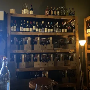 bottles of wine on shelves in a wine shop