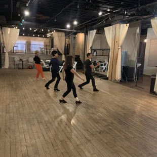 Group dance lessons inside Vintage Ballroom