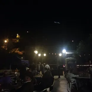 a crowd of people sitting at tables