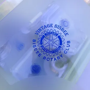 a hand holding a glass of wine