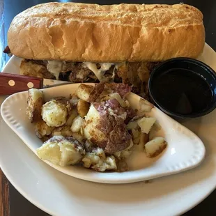 Vintage Dip Sandwich with smashed red potatoes on the side.