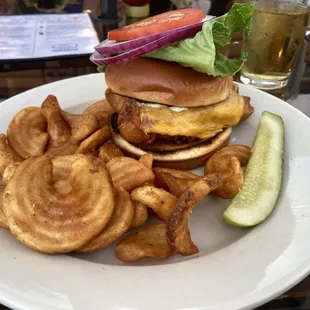 Wisconsin Fish Sandwich - VBC beer battered fried cod, American cheese, tartar sauce, lettuce, tomato, onion, brioche bun. Sidewinder fries.