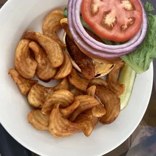 Wisconsin Fish Sandwich - VBC beer battered fried cod, with American cheese, tartar sauce, lettuce, tomato, &amp; onion on a brioche bun.