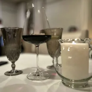 wine glasses and a candle