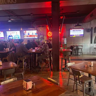 a group of people sitting at a bar