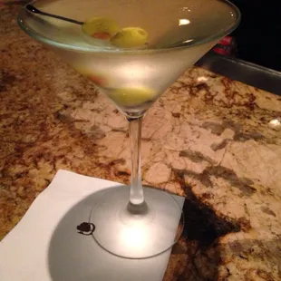 a martini with olives in it