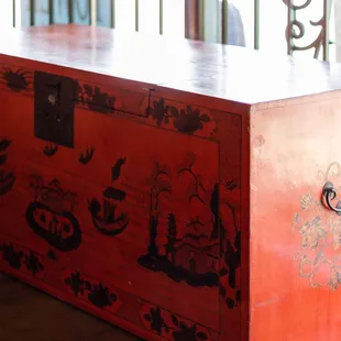 A unique find of a red asian inspired trunk