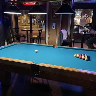 a pool table with a pool ball on it