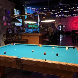 a pool table in a bar