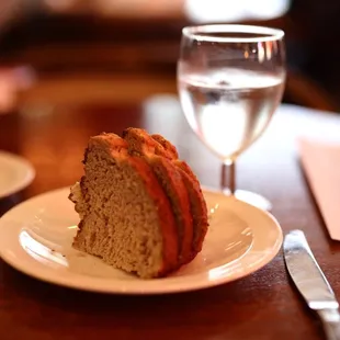 a slice of cake and a glass of water