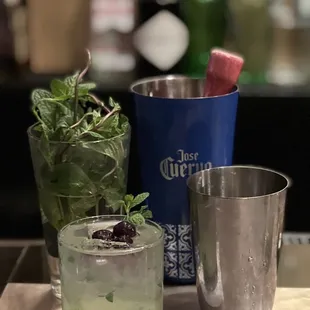 two cocktails on a bar