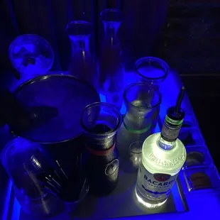 a tray of liquor bottles and glasses