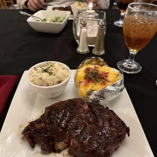 Ribeye with mashed potatoes and loaded baked potato