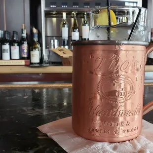 a copper mug on a bar